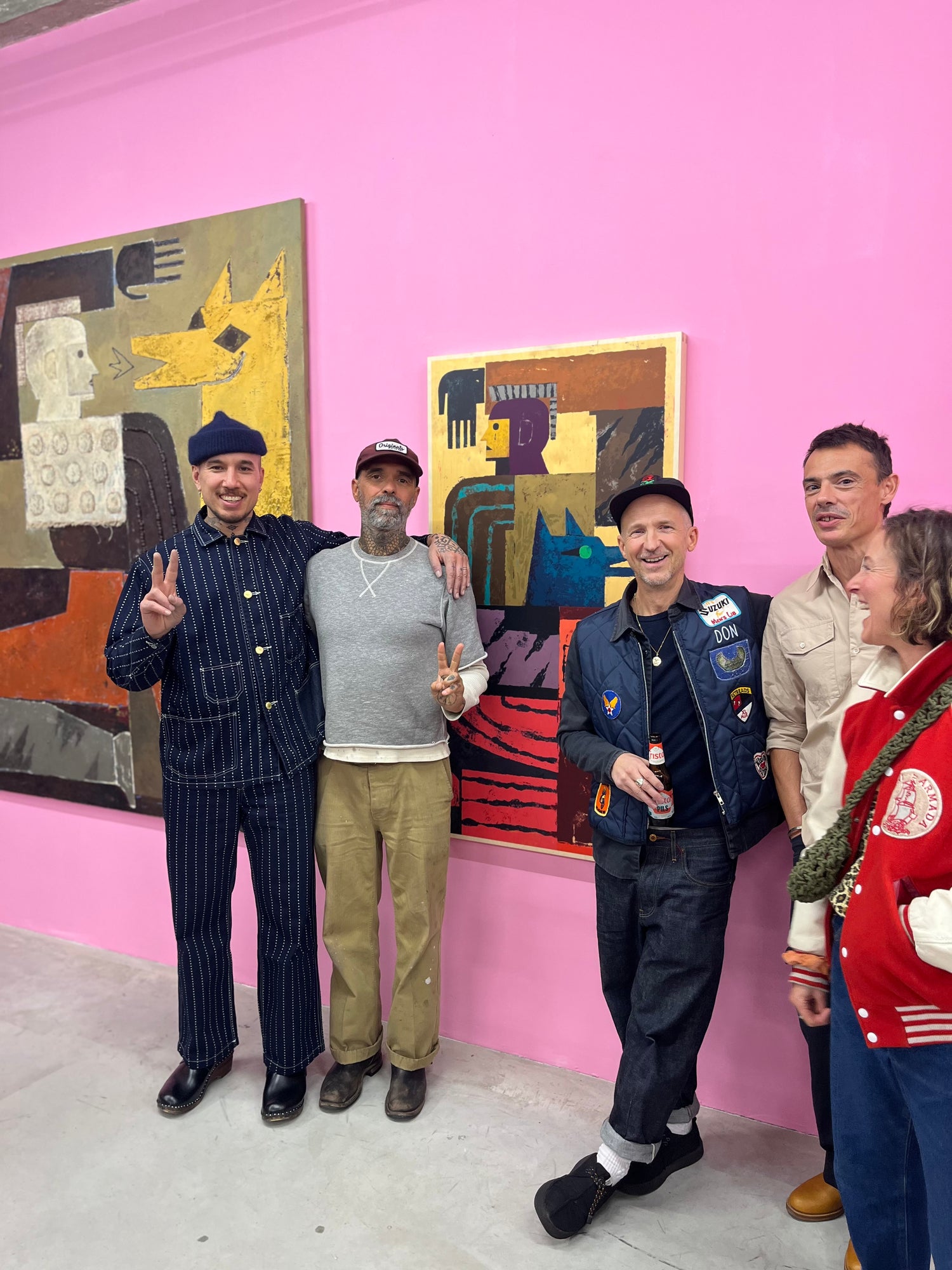 Jamel Armand with the founders of Art of Ping Pong and Gallery Hioco Delany standing in front of the Jamel Armand ArtTable at the Silk Song exhibition launch