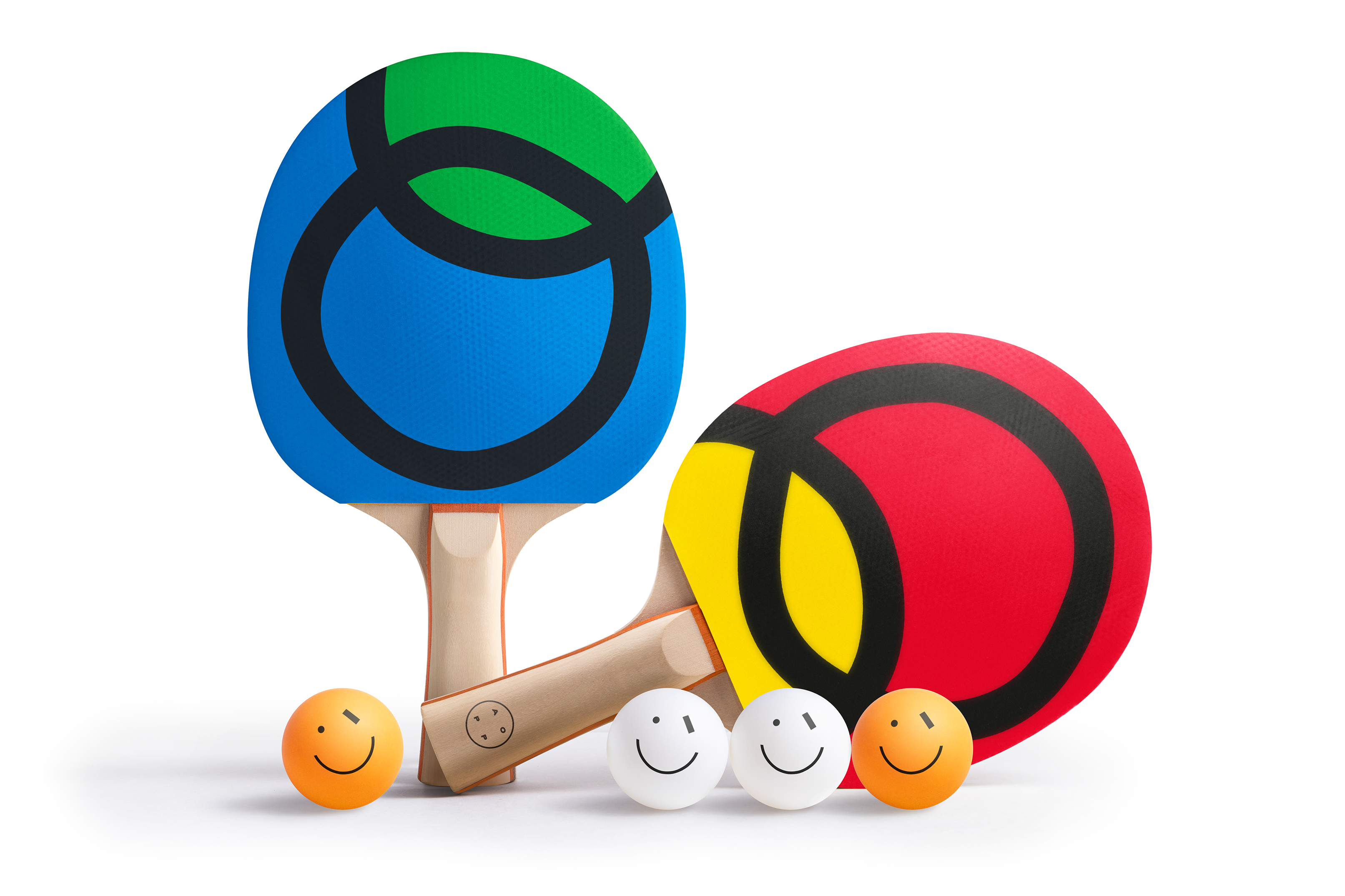 Two colorful ping pong paddles with smiley face balls on a white background