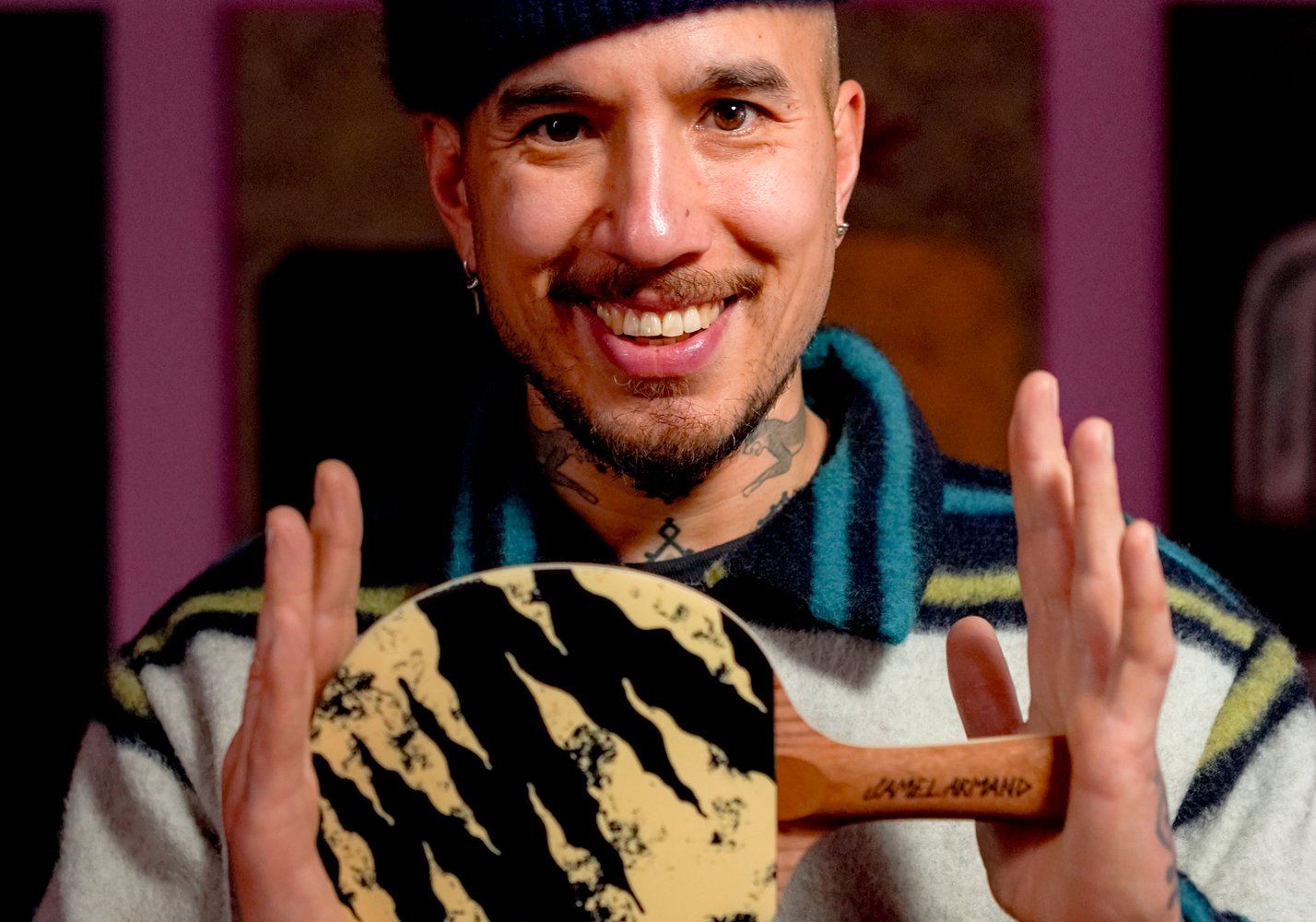 Jamel Armand holding his limited-edition Art of Ping Pong bat from the Silk Song collection