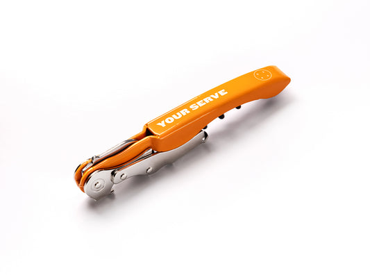 Orange tool with Art of Ping Pong's 'Your Serve' branding on a white background