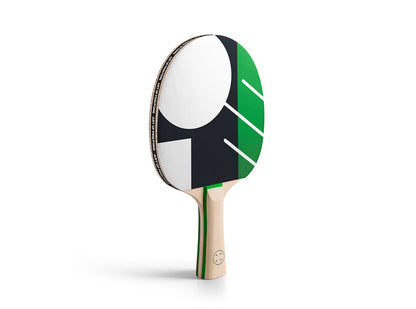 ITTF Centenary table tennis bat with geometric black, green and white rubber design and natural wood handle on white background.