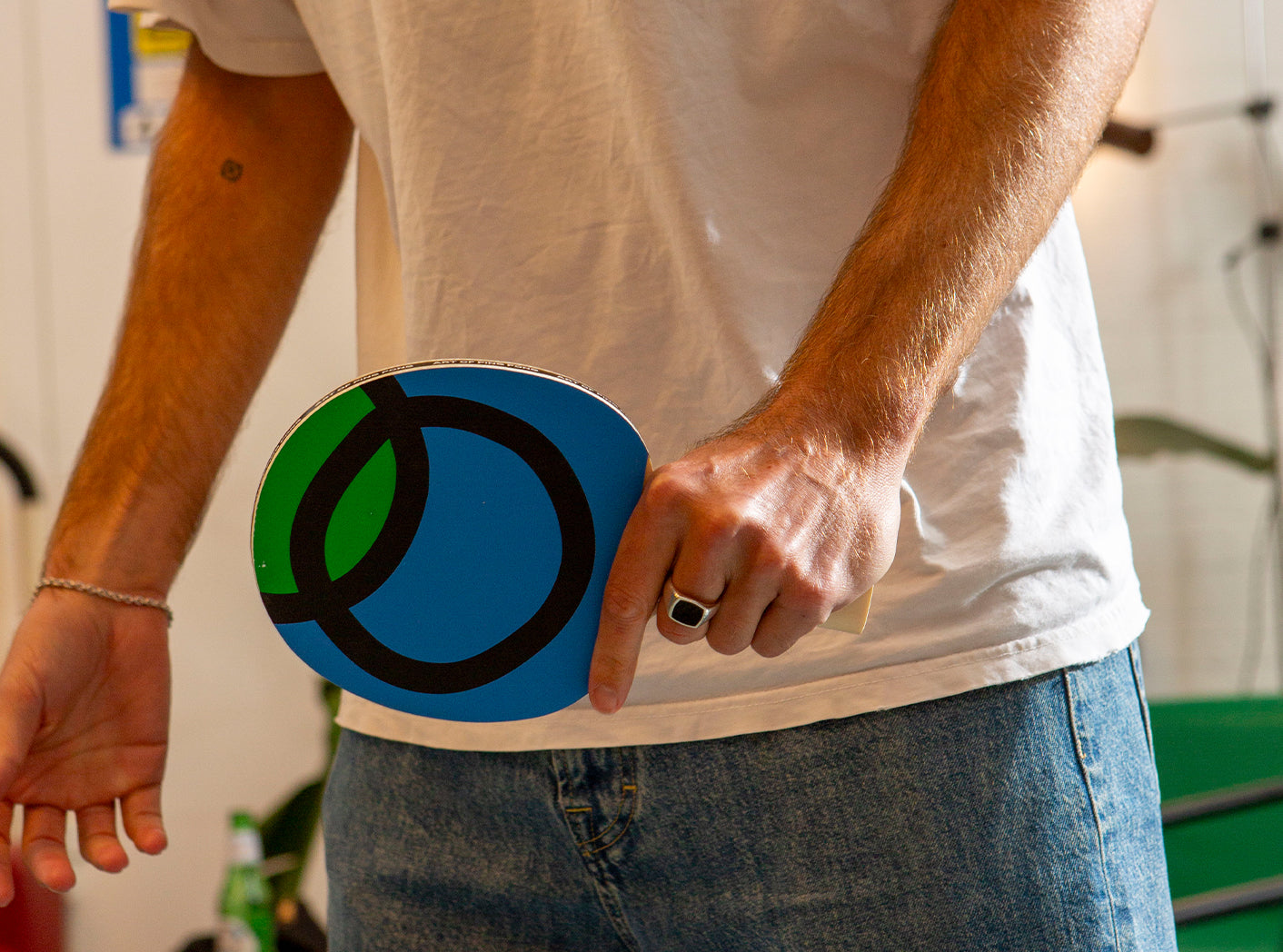 person holding the Infinite Loop ping pong bat by Art of Ping Pong