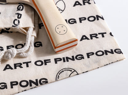 Ping pong paddle and bag on a 'Art of Ping Pong' branding
