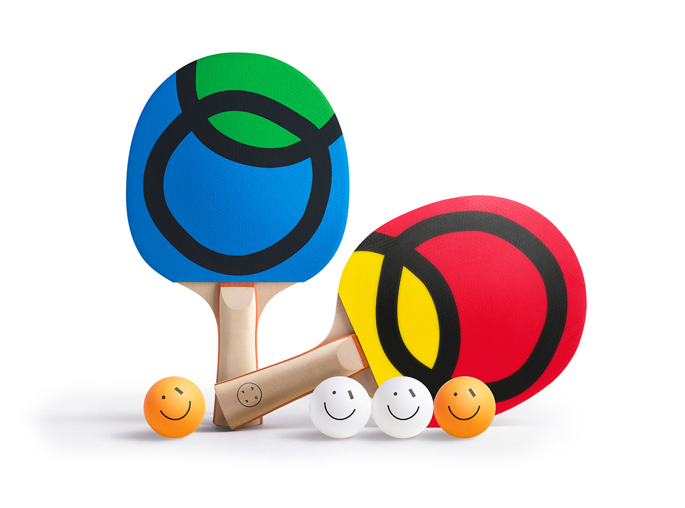 Colorful table tennis paddles with smiley face balls on a white background