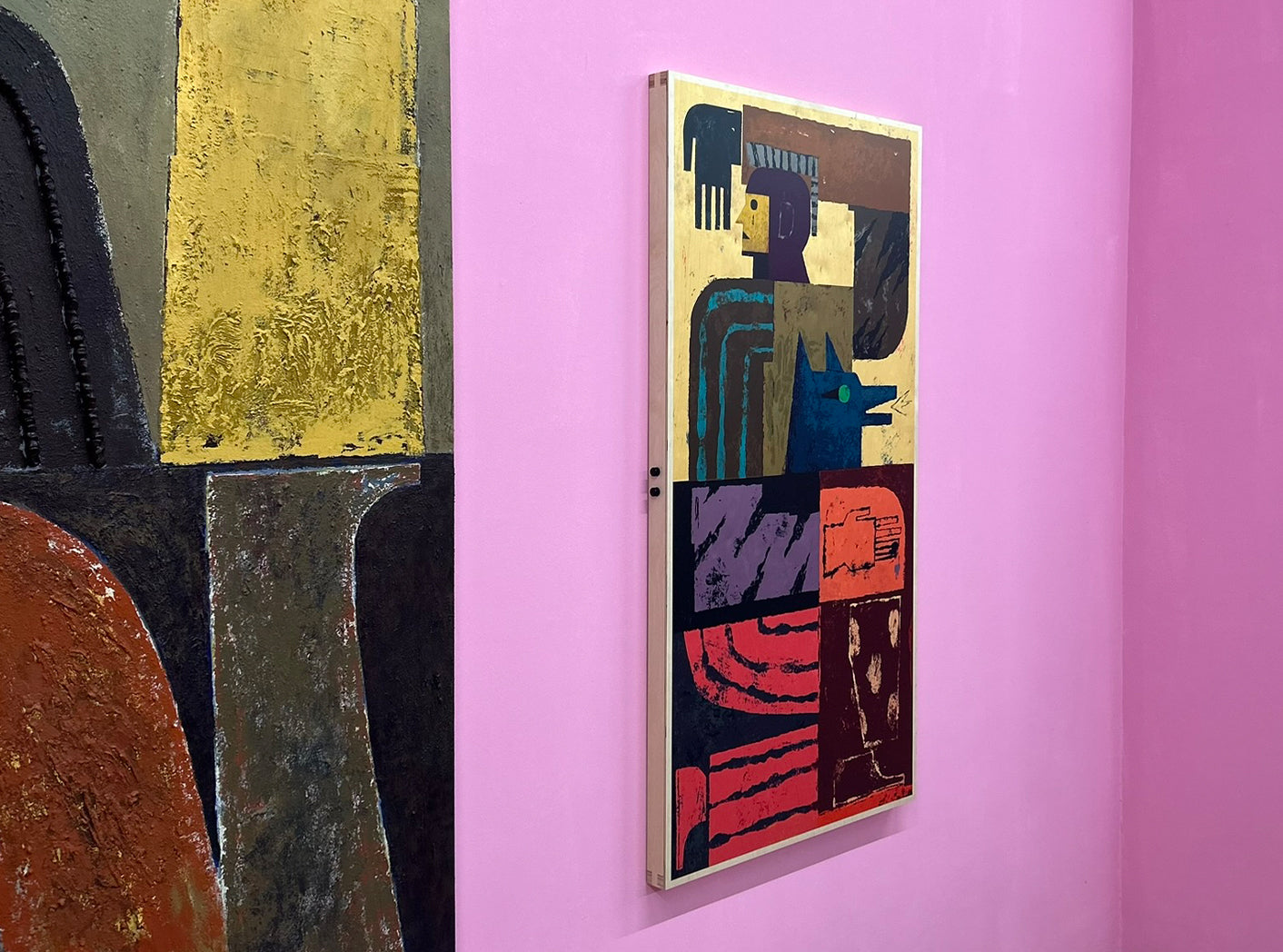 Jamel Armand ArtTable on a pink wall in a gallery space