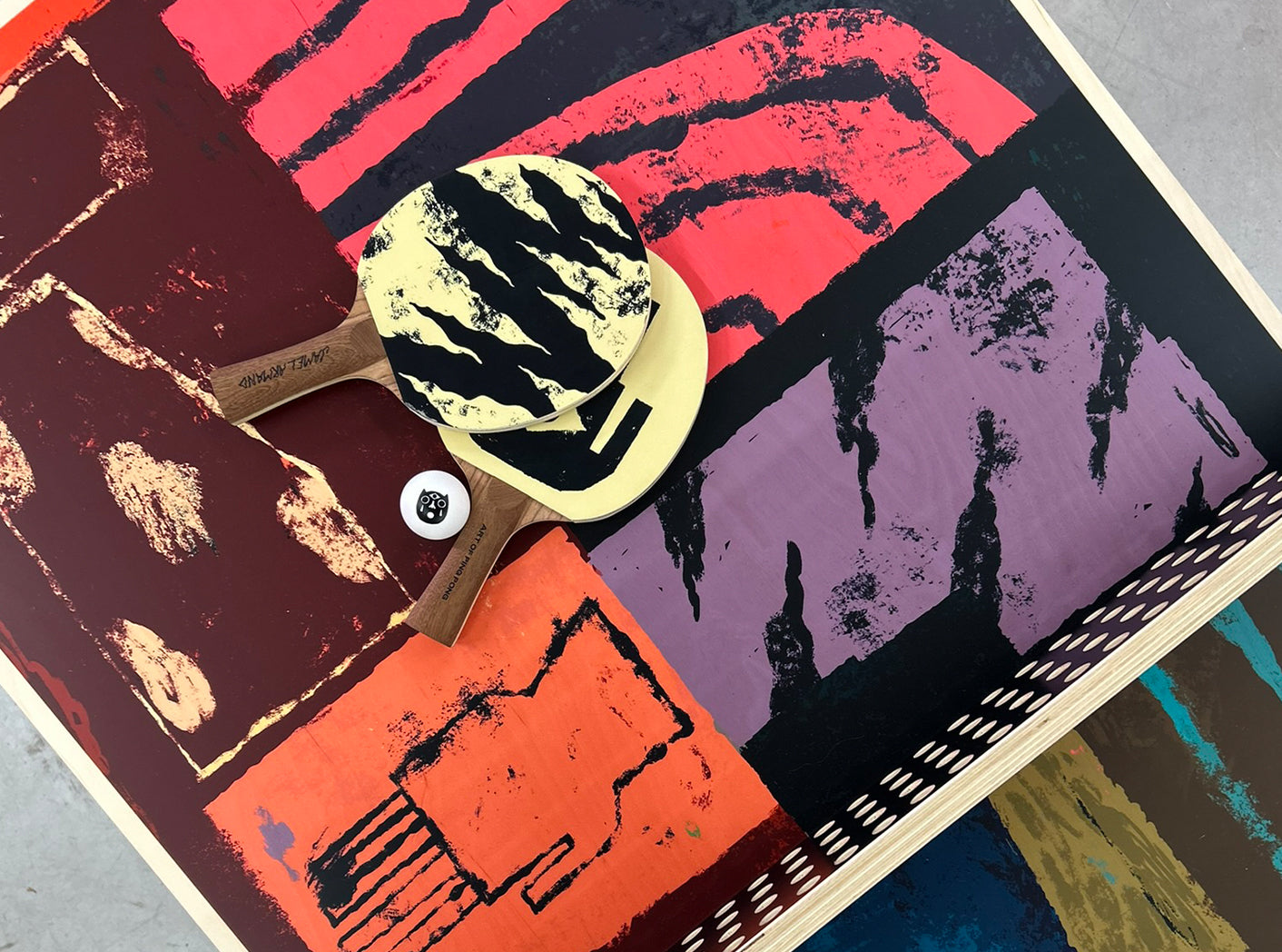 Table tennis paddles with a colourful abstract design by Jamel Armand