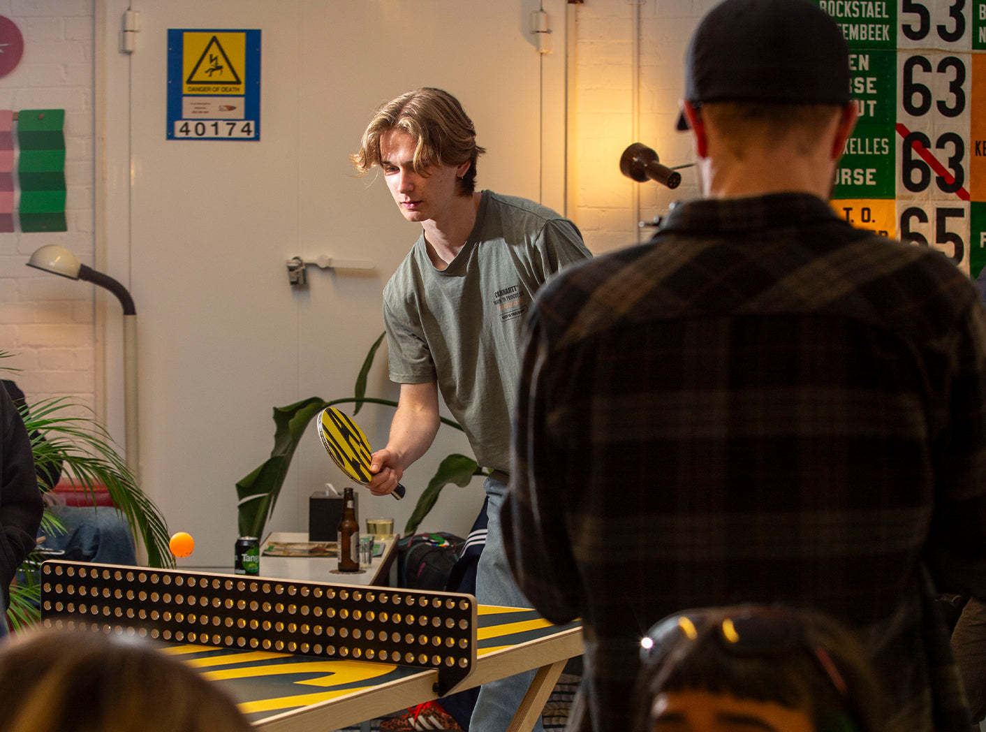 Two men playing a game at a table with a casual setting