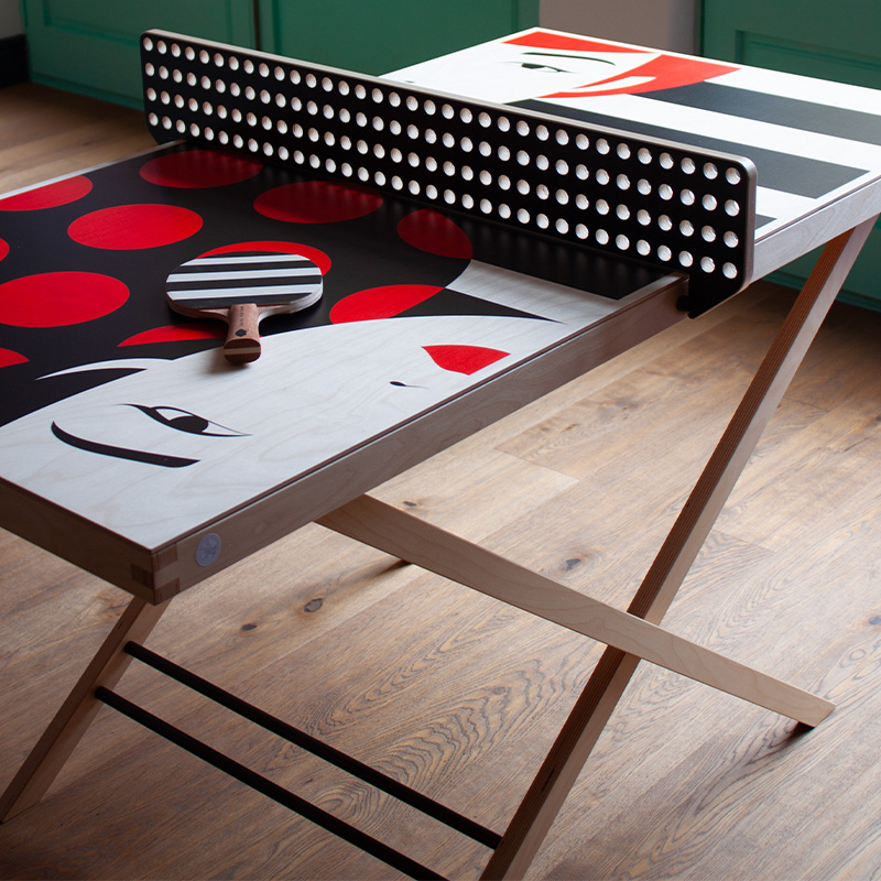 ArtTable. Malika Favre. Wall mountable ping pong table art. And Malika Favre Table Tennis Bats in studio.